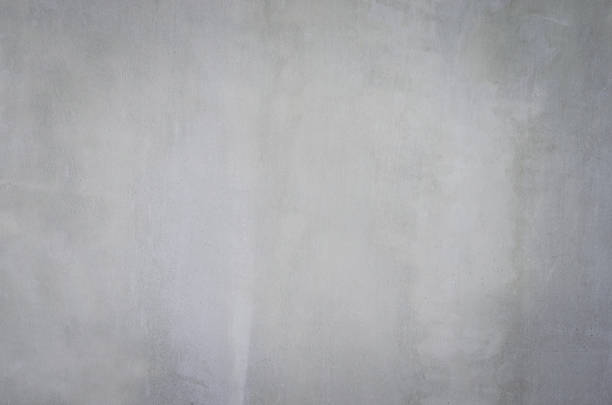 istock gray concrete background texture clean stucco fine grain cement wall clear and smooth white polished. 1072579788
