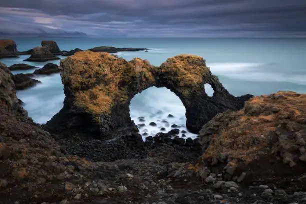 Photo of Volcanic cliffs and basalt rocks in Arnarstapi, Iceland