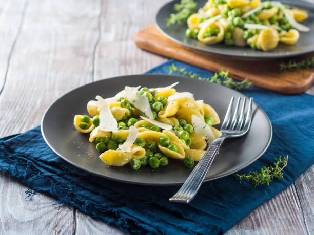 istock Italian orecchiette pasta with peas and cheese 1072580020