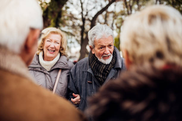 istock Senior couples talking in the park 1072580258