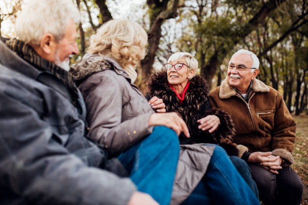 istock Senior couples sitting in the park 1072580558