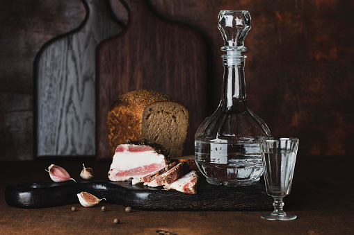 still life with vodka, bread and bacon in Russian style