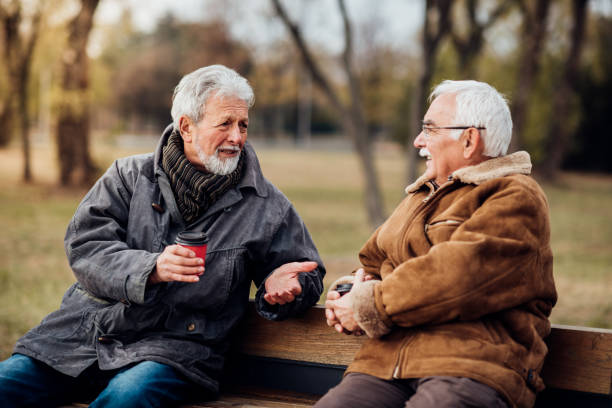 istock Senior men sitting on a bench talking 1072584998