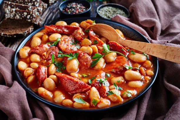 istock beans stew with sausages in a bowl 1072585154