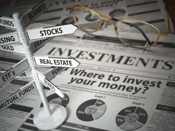 investmments and asset allocation concept. where to invest? newspaper and direction sign with investment options. - stock certificate finance business wealth imagens e fotografias de stock