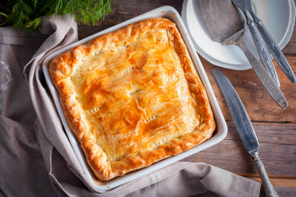istock Puff pastry pie with chicken, potatoes and onions, quute pie, selective focus, top view 1072595536