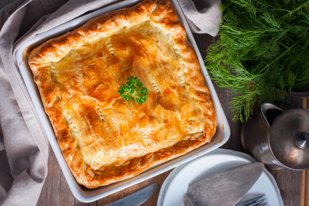 istock Puff pastry pie with chicken, potatoes and onions, quute pie, selective focus, top view 1072595558