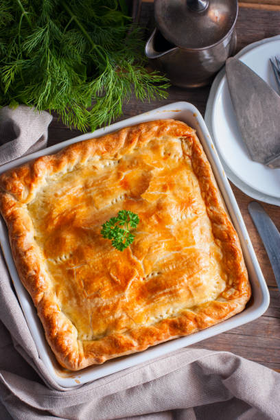 istock Puff pastry pie with chicken, potatoes and onions, quute pie, selective focus, top view 1072595572