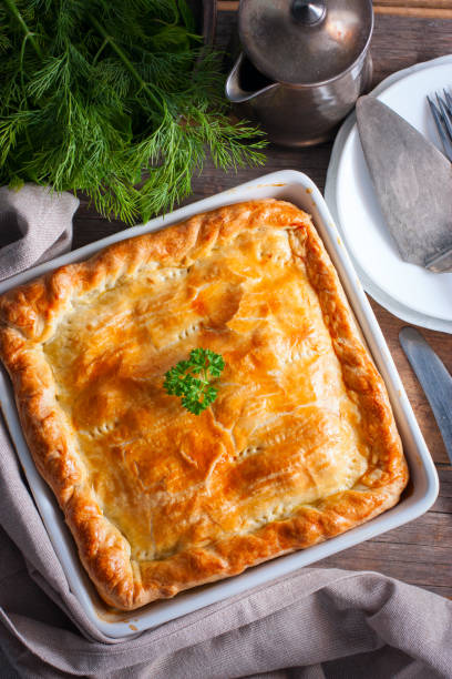 istock Puff pastry pie with chicken, potatoes and onions, quute pie, selective focus, top view 1072595598
