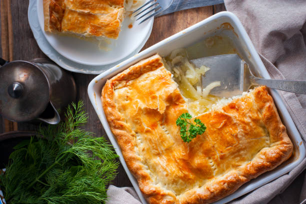 istock Puff pastry pie with chicken, potatoes and onions, quute pie, selective focus, top view 1072595844