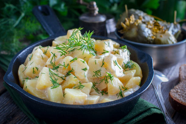 istock young potatoes cooked in sour cream in a cast iron pan, horizontal 1072599032
