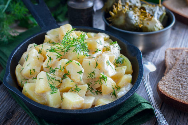 istock young potatoes cooked in sour cream in a cast iron pan, horizontal 1072599062