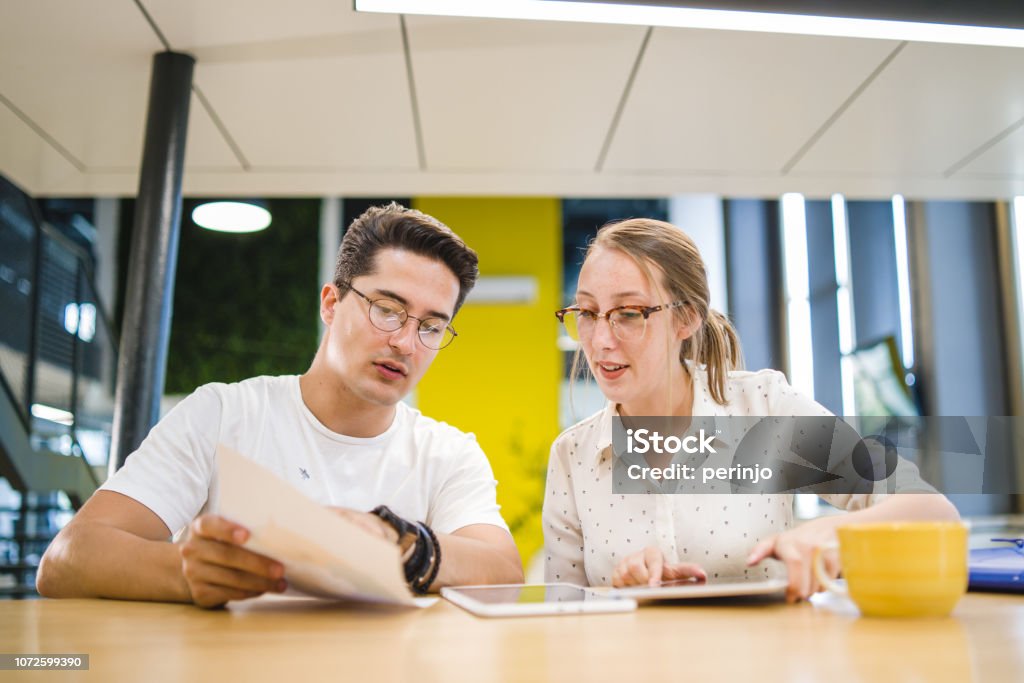 They share a great working relationship Coworkers arguing about work, researching, brainstorming new ideas. 20-24 Years Stock Photo