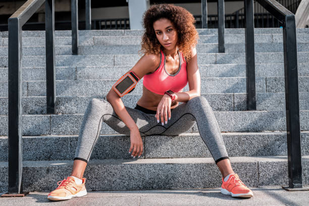 istock Pleasant young woman resting after a workout 1072601102