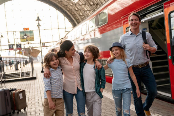 istock Happy family traveling by train 1072601506
