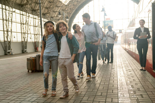 istock Happy family traveling by train 1072601512
