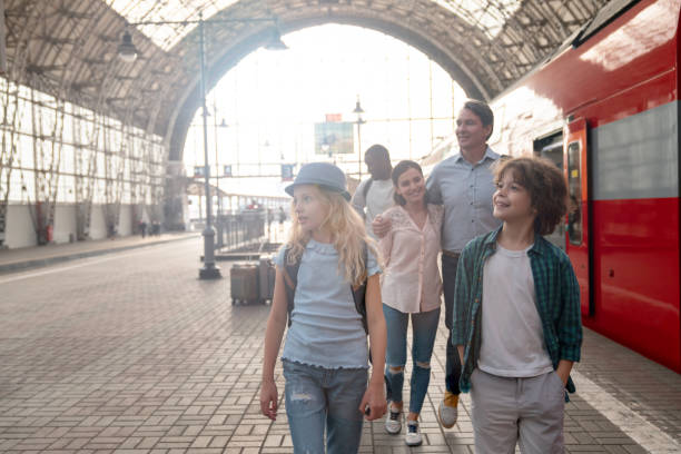 istock Happy family traveling by train 1072601520