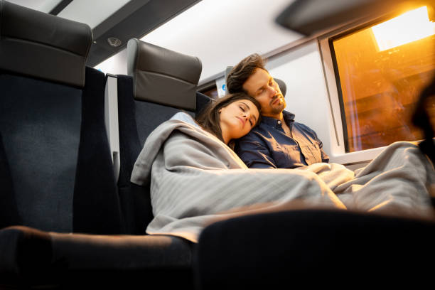 istock Loving couple traveling by train 1072601618