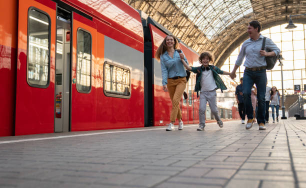 istock Happy family traveling by train 1072601710