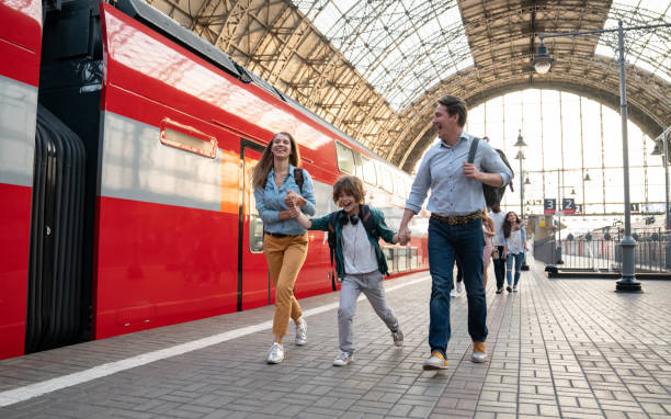 istock Happy family traveling by train 1072601722