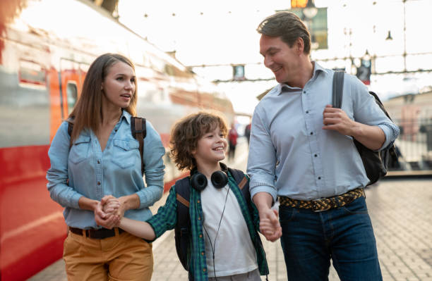 istock Happy family traveling by train 1072601732