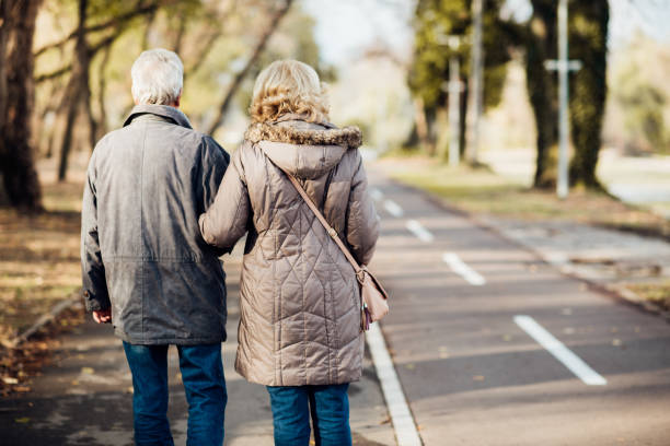 istock Senior couple taking a walk in the park 1072604340