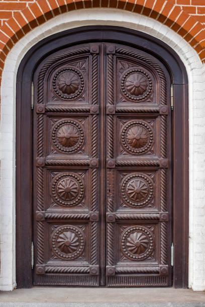 istock old carved wooden door 1072604384