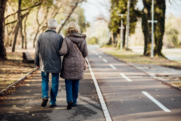 istock Senior couple taking a romantic walk in the park 1072604426