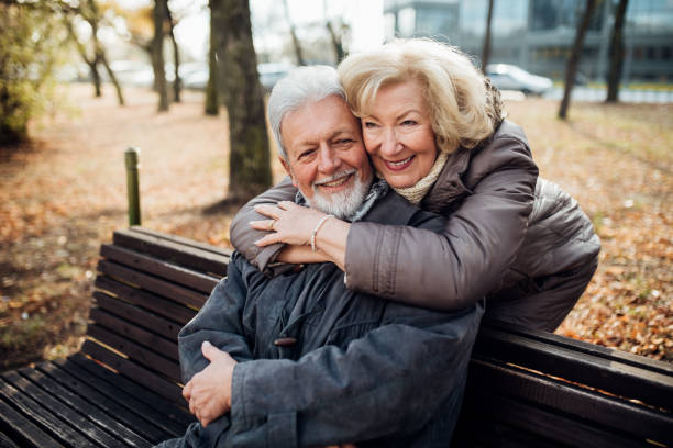 istock Senior couple sitting in the park 1072604606