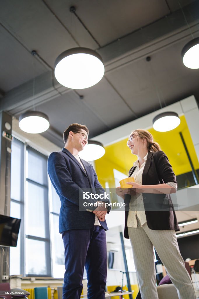 Colleague chit chat on a break Portrait of young coworkers. They are well dressed,they are also smiling a lot. 20-24 Years Stock Photo