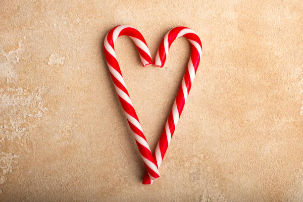 istock Peppermint Candy Canes in Heart Shapes. 1072605846