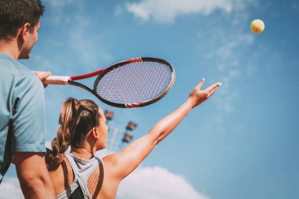 istock Girl Practice Tennis With Coach 1072609324