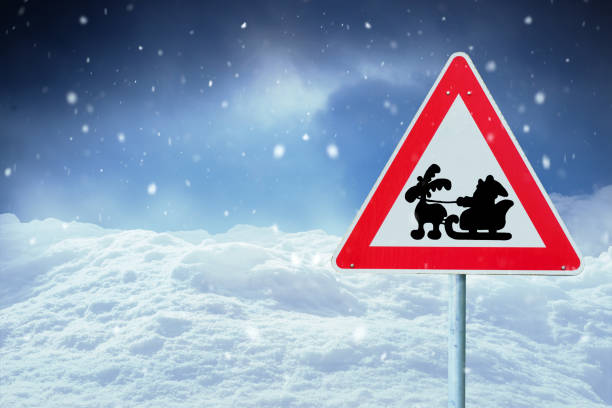 Santa Claus road sign in winter landscape