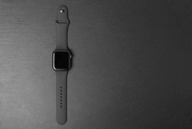 2018-11-22 Kyiv, Ukraine. Apple Watch Series 4 on gray background. New smart watches from the company APPLE close up.