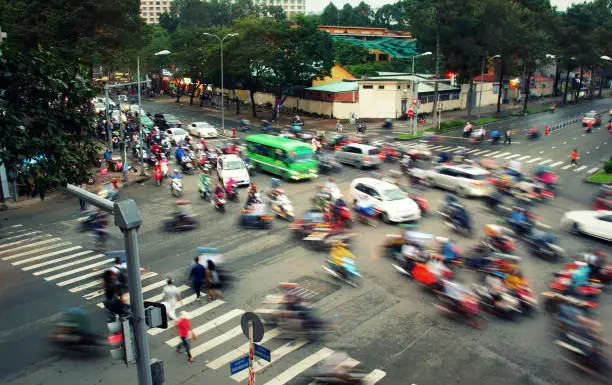 Traffic in Ho Chi Minh City (Saigon), motorbikes, cars, busses, bycicles. city business