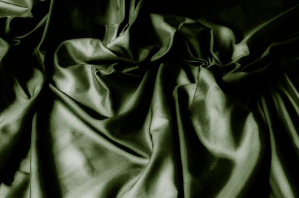 istock Texture, background, pattern. Green silk fabric. Beautiful pure silky fabric dupioni in lavender. 1072626868