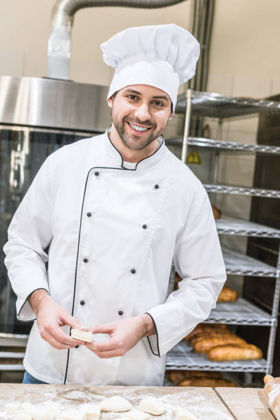 istock smiling cheerful baker with raw products at kitchen 1072630618