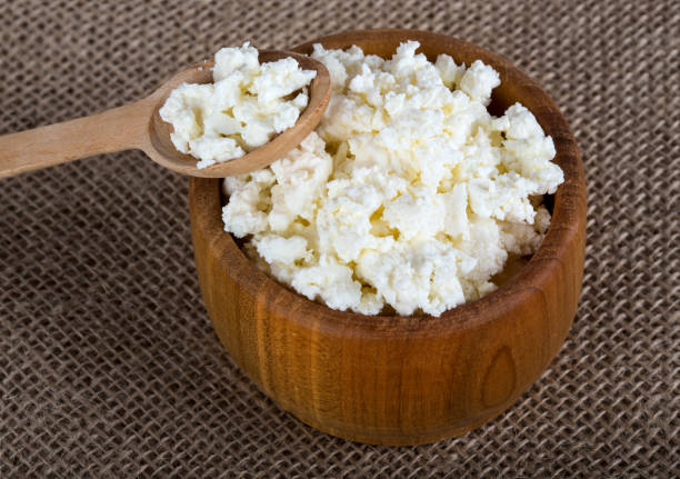 istock Cottage cheese in wooden bowl 1072630830