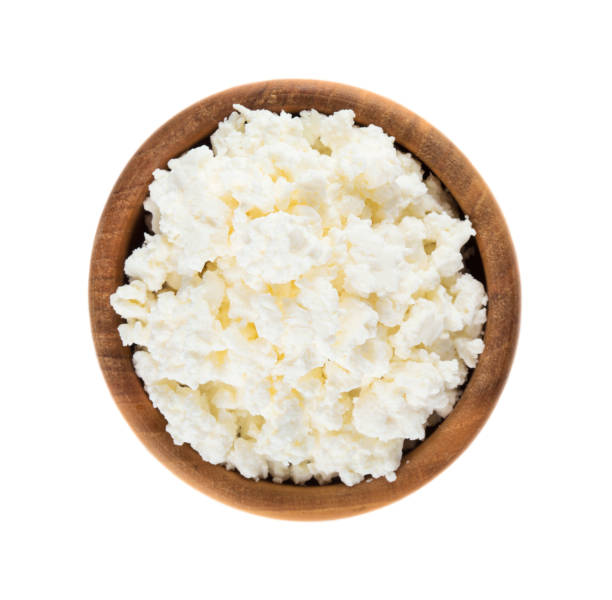 istock Cottage cheese in wooden bowl 1072630842