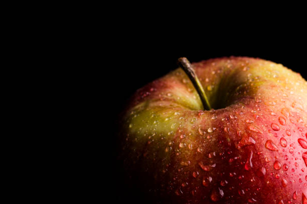 istock Red Apple Covered in Water Droplets 1072636124