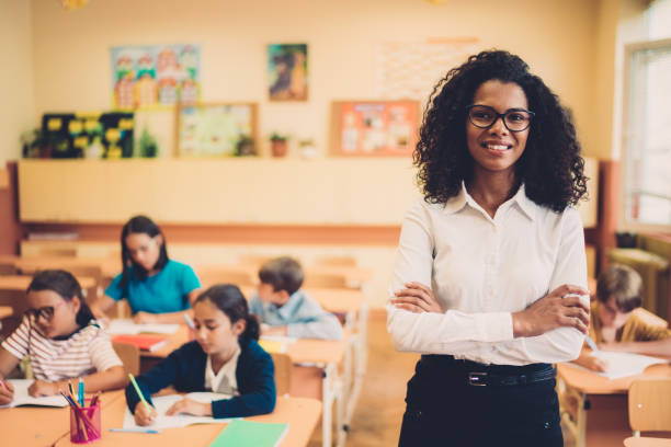 istock Portrait of smiling teacher in class 1072642206