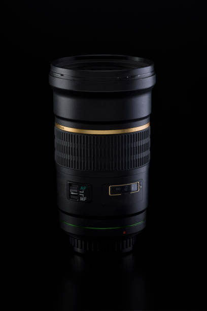 istock Black camera lens on a black background, close-up 1072646876