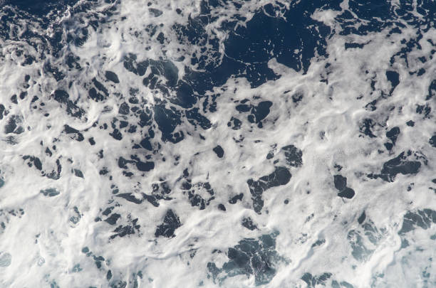 istock Sea water background with white foam. 1072654464