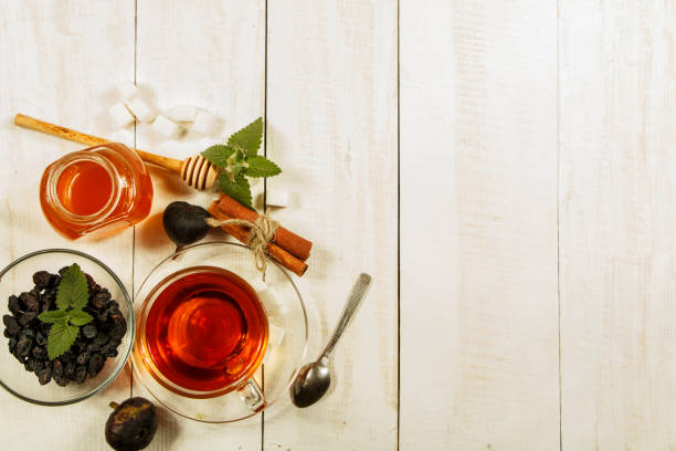 istock A cup of tea on a white table.Traditional Arabic, Turkish Ramadan tea with dry dates and raisins on a wooden white table. Turkish fresh tea with dates. Ramadan kareem. Ramadan background. 1072654626