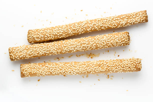 bread sticks on white bread sticks with sesame seeds on white breadstick stock pictures, royalty-free photos & images