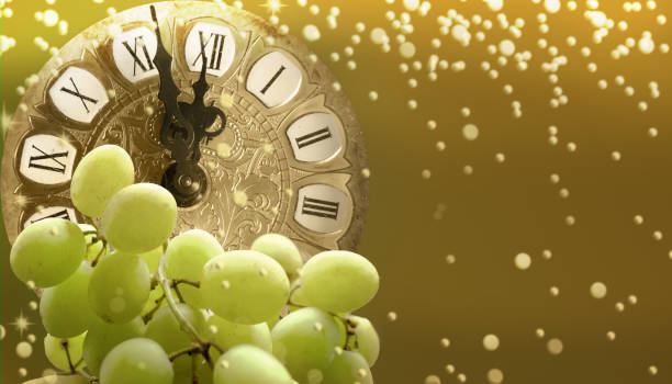 Midnight on New year's eve in Spain eating twelve grapes Midnight on New year's eve in Spain eating twelve grapes number 12 photos stock pictures, royalty-free photos & images
