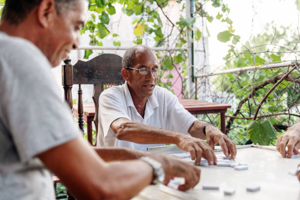 istock Good old latino friends playing dominos 1072666992