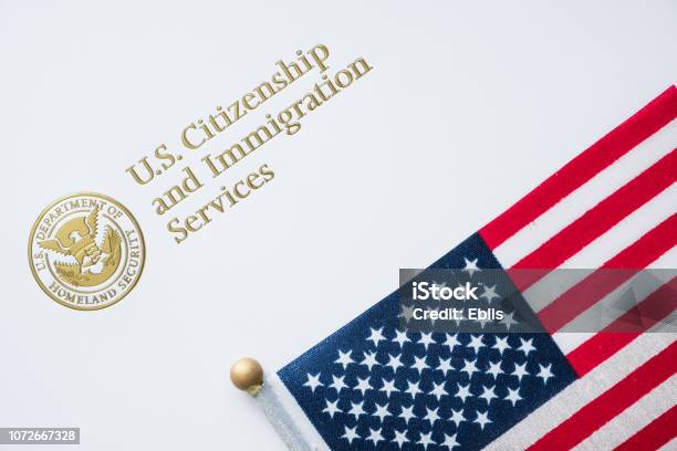 Envelope From Us Citizenship And Immigration Services With The American Flag On Topus Immigration Concept Stock Photo - Download Image Now