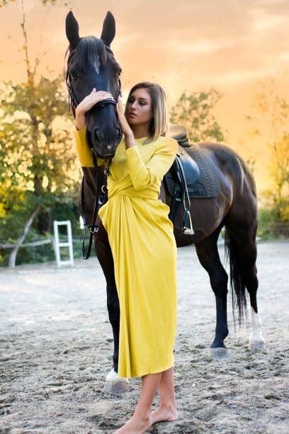 istock Young beautiful woman with a horse 1072669714
