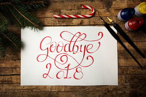 Goodbye 2018 written in red ink with calligraphic letters